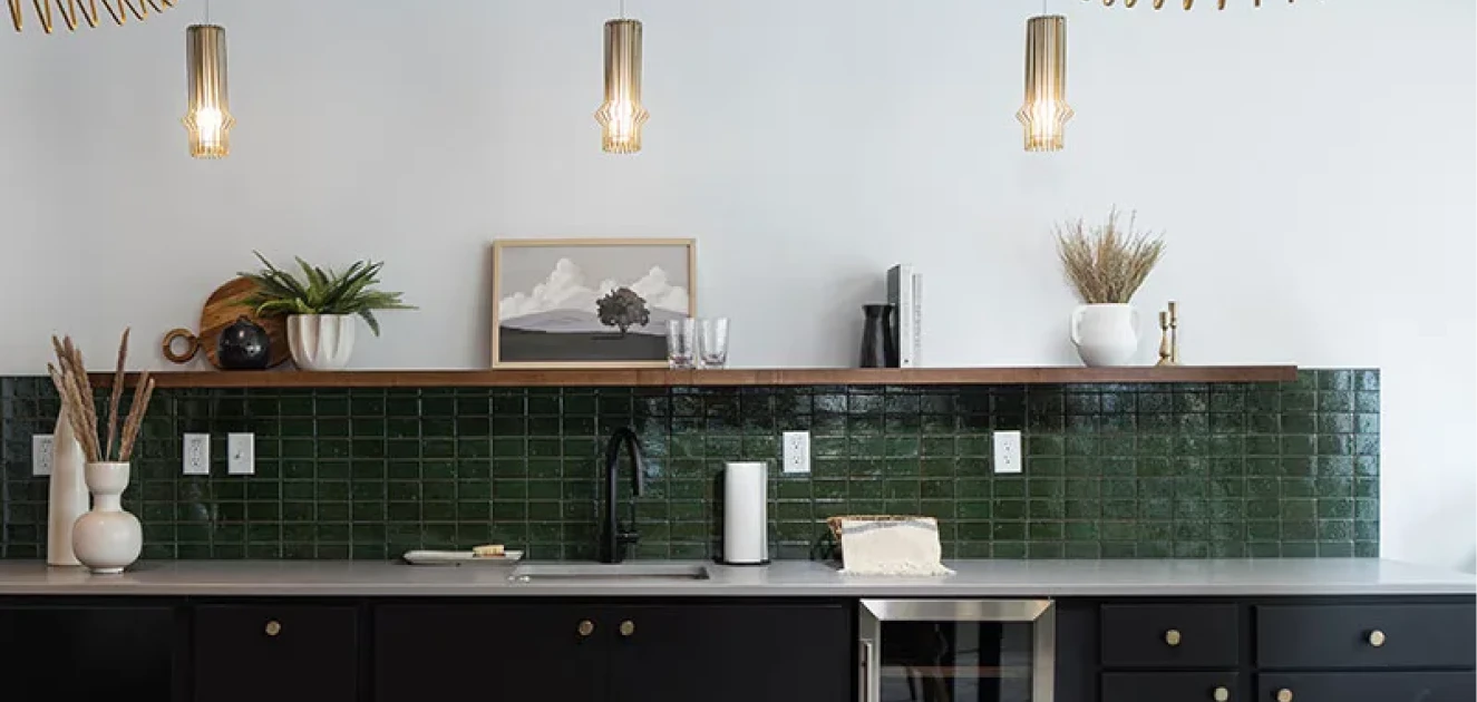 a kitchen with a sink and a picture on the wall.