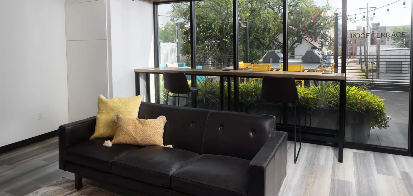 a couch in a room with windows.