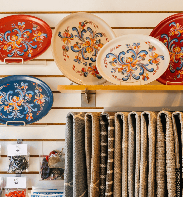 a display of plates and rugs