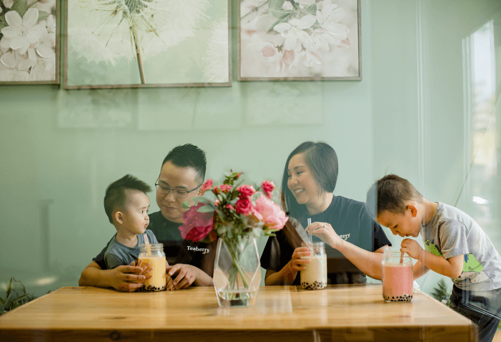 a group of people sitting at a table with drinks