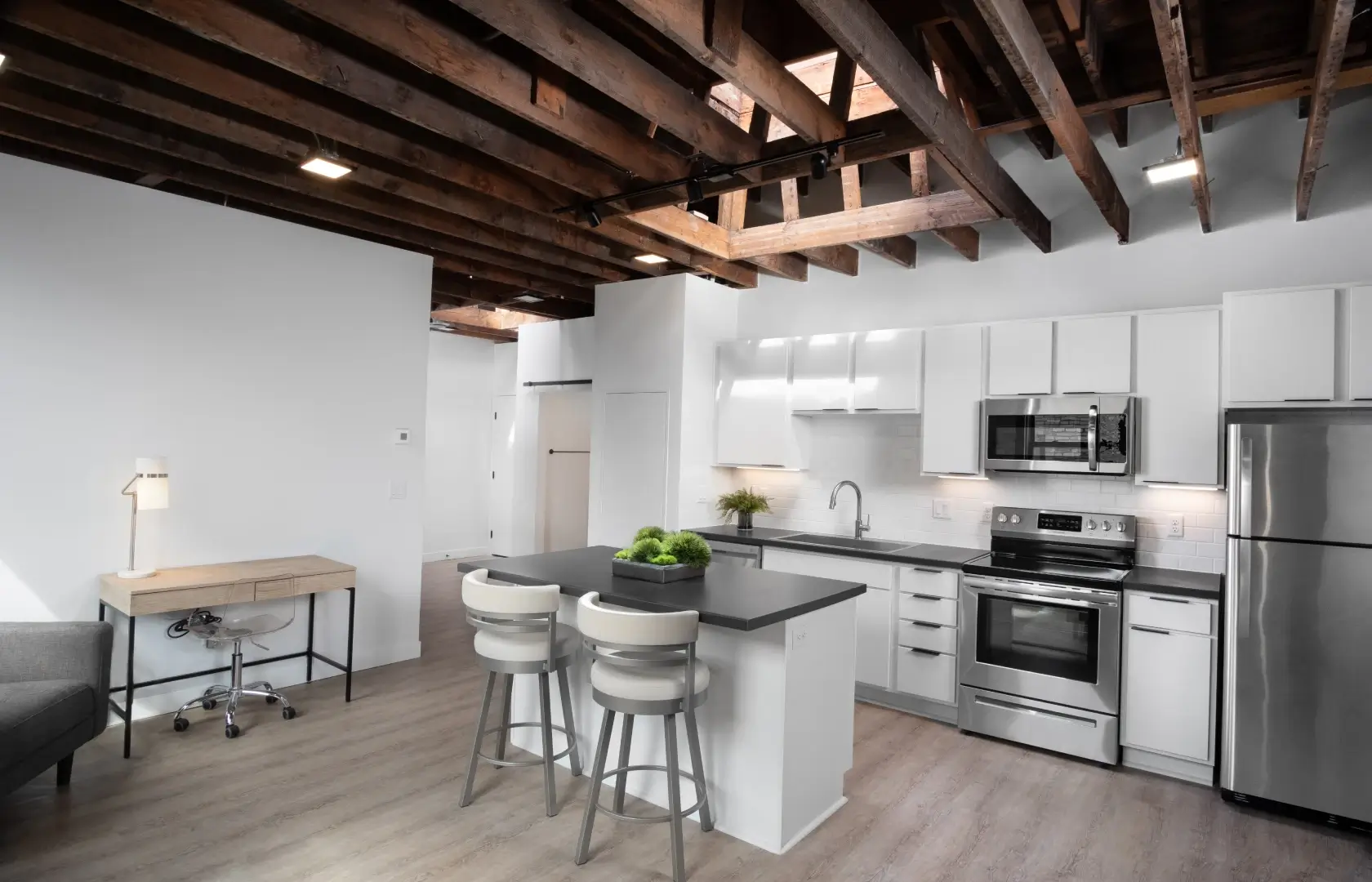 Bostad interior featuring a kitchen with a wood ceiling and a table.