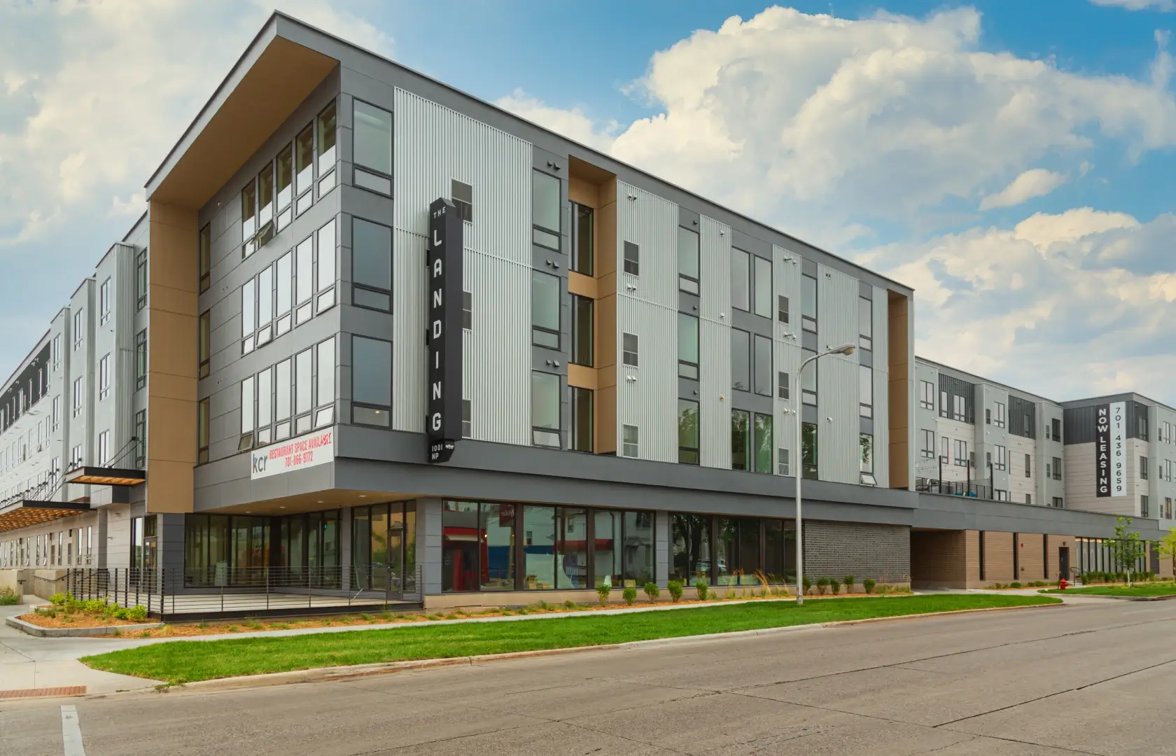 a building with a street and grass.